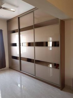 an empty room with sliding doors in it