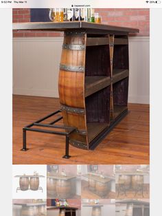 an old fashioned wooden barrel table with wine glasses on top and two shelves below it