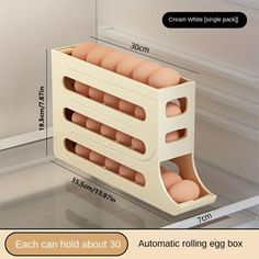 an automatic rolling egg box is shown with the instructions for how to put eggs in it