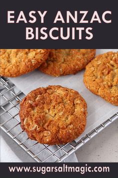 some cookies are on a cooling rack with the words easy anzac biscuits in front of them