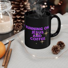 a coffee mug with the words running on jesus and coffee next to some cinnamons