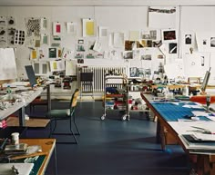 an art studio with multiple tables and chairs