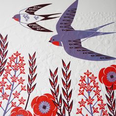 two birds are flying over some red and white flowered plants on a white background