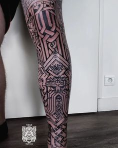 a man's leg with an intricate pattern on it