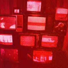 an array of televisions are shown in red and pink colors on a screen background