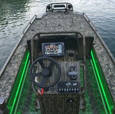 the inside of a boat with a steering wheel and other items on it's deck