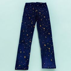 These Stars Print Pants Are A Stylish And Comfortable Addition To Any Wardrobe. The Pants Feature A Unique And Eye-Catching Design With A Combination Of Navy Blue And Yellow Colors, Along With A Touch Of Black. The Stars Pattern Adds A Playful And Feminine Touch To The Outfit. These Pants Are Perfect For Casual Wear Or As A Statement Piece For A More Formal Occasion. The Stretchy Fabric Ensures A Comfortable Fit, Making Them Suitable For Various Body Types And Occasions. Pair Them With A Matchin Star Pj Pants, Star Pjs, Star Print Pants, Navy Blue And Yellow, Patterned Pants, Star Clothing, Stars Pattern, Cute Leggings, Stretchy Leggings