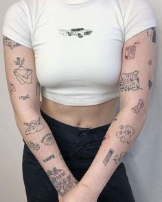 a woman with many tattoos on her arms