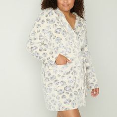 You'll love the celestial print and cozy design of this Sleep Chic women's plus robe for your nighttime routine. Made from soft fleece, this short robe has tassel tie closures for the hooded neck and a belted waist, plus two front slip pockets. Wear it over your favorite PJ set with slippers. Closure Type: TieNeckline: Hooded NeckPockets: 2 Front Slip PocketsSleeve Length: Long SleeveApparel Length: 38 InchesFiber Content: 100% PolyesterFabric Description: FleeceLining: UnlinedRobe Length: Mid … Celestial Print, Nighttime Routine, Cozy Design, Night Time Routine, Chic Woman, Pj Sets, Mid Length, Product Description, Long Sleeve