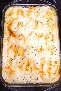 a casserole dish with cheese and chicken in it