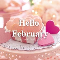 there are hearts on the table for valentine's day celebration with words hello february