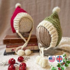 two knitted hats sitting on top of a table