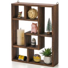 a wooden shelf filled with different types of ornaments and decorations on top of it's sides