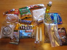 an assortment of snacks and condiments laid out on a table