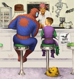 a man sitting at a counter with a little boy in front of him, who is wearing a spiderman costume