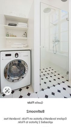 a bathroom with a washer and dryer in it