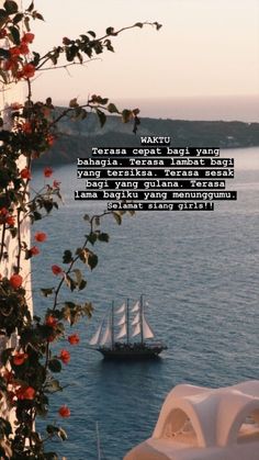 there is a boat that is in the water near some trees and flowers with a quote on it