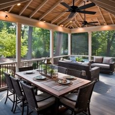 a covered porch with wicker furniture and ceiling fan