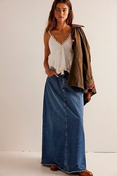 Forever cool and classic denim maxi from our We The Free collection. **Fit:** Mid-rise, A-line silhouette and rigid denim **Features:** Zip fly and button closure, four-pocket design, inverted yoke seam at front, raw-edge hem **Why We | We The Free Come As You Are Denim Maxi Skirt at Free People in Dark Wash, Size: US 6 Long Denim Skirt Outfit, Jean Skirt Outfits, Long Jean Skirt, Denim Skirt Outfits, Long Denim Skirt, Maxi Skirt Outfits, Denim Maxi, Free People Skirt, Denim Maxi Skirt