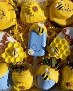 cupcakes decorated like bees and honeycombs are in a box