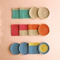 crocheted placemats and coasters are arranged on a pink surface