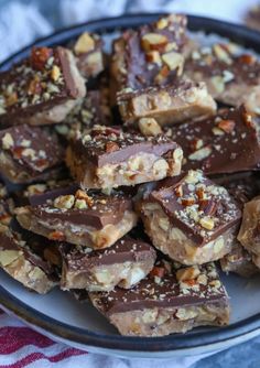 a plate filled with chocolate and nuts on top of a table