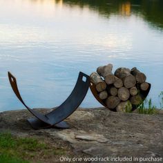 there is a firewood rack next to the water