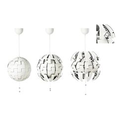 three white globes hanging from the ceiling with different angles and shapes on each one