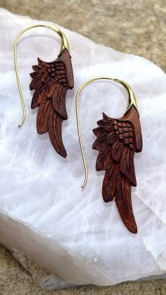 Our exquisite handcarved redwood & brass wing earrings❤️ a stunning accessory that combines natural beauty with intricate design. Crafted from high-quality redwood and brass materials, these earrings feature delicately carved wing shapes that mimic the grace and elegance of a bird in flight. The smooth, polished surface of the redwood perfectly complements the warm, golden tones of the brass, creating a striking contrast that is sure to catch the eye. At approximately 2 inches in length, these earrings are the perfect size to make a statement without overwhelming your look. The lightweight design ensures that they are comfortable to wear all day long, whether you're dressing up for a special occasion or adding a touch of glamour to your everyday style. Each pair of earrings is meticulously Wing Shapes, Bird In Flight, Brass Hoop Earrings, Feather Jewelry, Spiral Earrings, Wing Earrings, Wedding Jewelry Earrings, Rose Gold Jewelry, The Grace