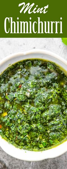 a white bowl filled with green soup next to a spoon and some other food items