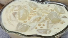 a glass bowl filled with ice and cream