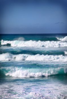 some very pretty blue ocean waves in the water