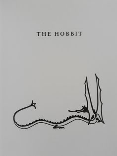 the hobbit is written in black ink on a gray background with an alligator's tail