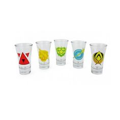 six shot glasses with different colored designs on them, all lined up in a row