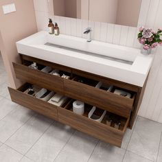 a bathroom with a sink and drawers in it