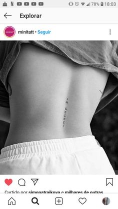 the back of a woman's stomach with an inscription on it