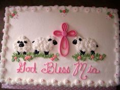 a cake decorated with three sheep and a pink bow on it's side that says god, miss