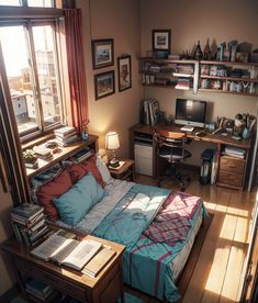 a bedroom with a bed, desk and computer on the table in front of it