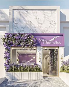 a purple and white store front with flowers on it