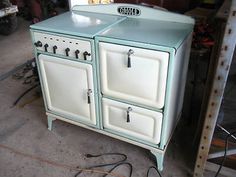 an old fashioned stove is sitting in the garage