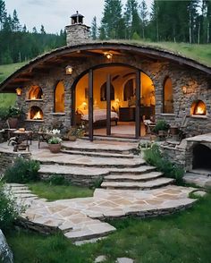 an outdoor living area with stone steps leading up to it