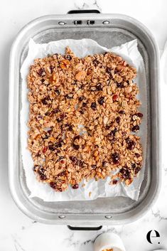 granola in a baking pan ready to go into the oven with eggs and milk