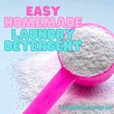 an easy homemade laundry deterant is in a pink spoon on top of white powder