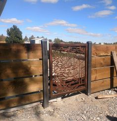 a gate that is made out of wood and metal