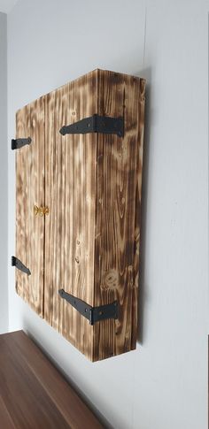 a wooden box hanging on the wall