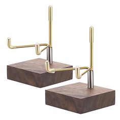 two wooden blocks with metal handles on them