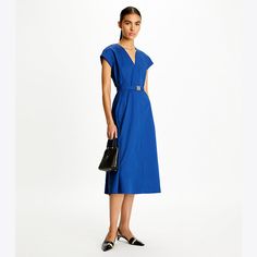 The new collection is defined by clean lines, interesting textures and elegant silhouettes. Our v-neck poplin dress is an effortless and versatile, with a nipped-in waist and a-line skirt. Wear it with or without the matching belt. Formal Casual Dresses, Drapey Dress, Casual Formal Dresses, Cocktail Formal, Dresses Cocktail, Formal Casual, Poplin Dress, Wool Dress, Ladies Dress Design