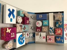 a close up of an open book with magnets on the front and numbers on the back