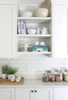 an image of a kitchen with white cabinets and counter tops on pinter's page