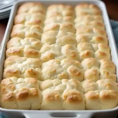 a white casserole dish filled with bread